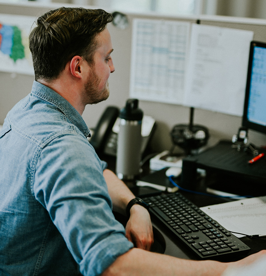 Planes employee working at computer