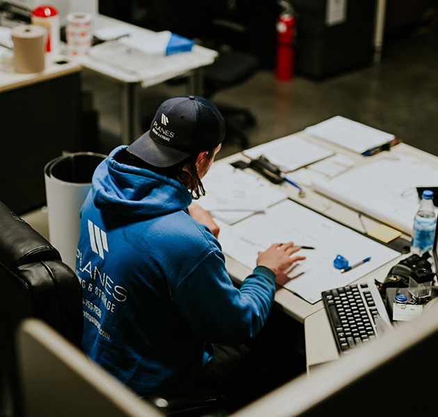 Planes employee doing paperwork