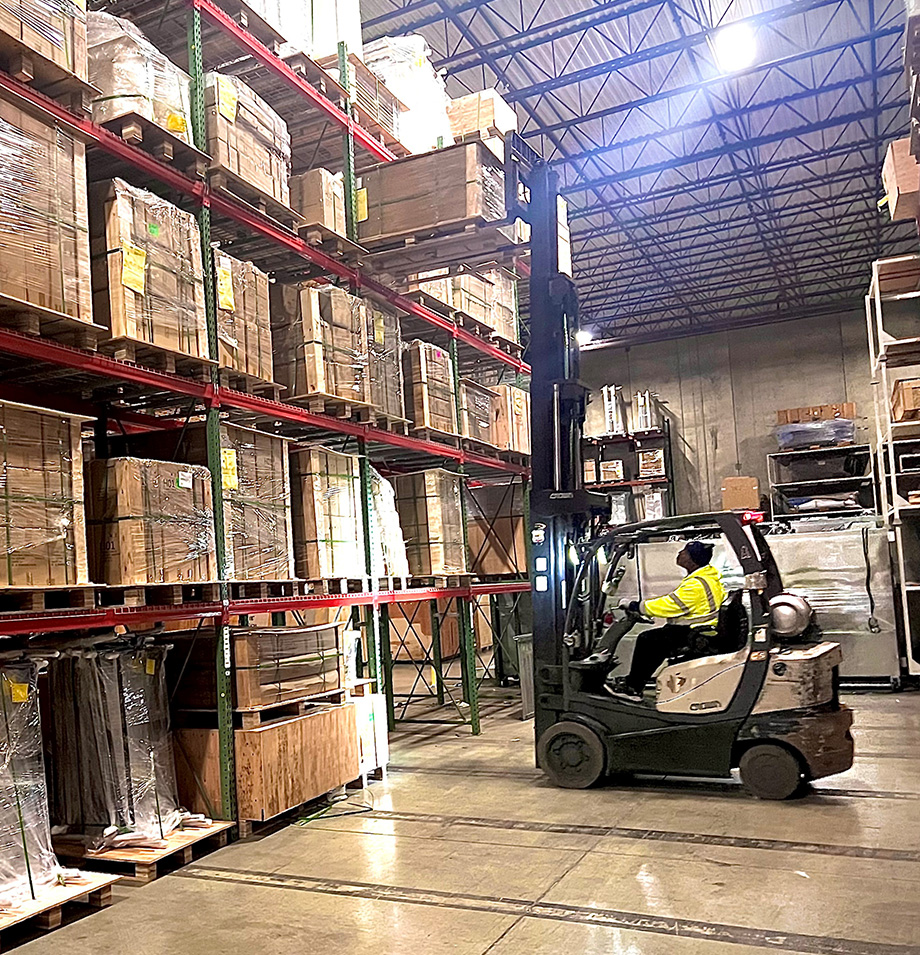 Planes employee on Forklift lifting boxes