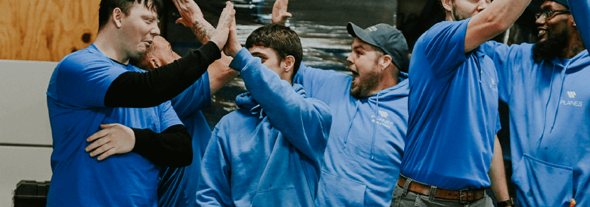 Planes Companies employees hi fiving