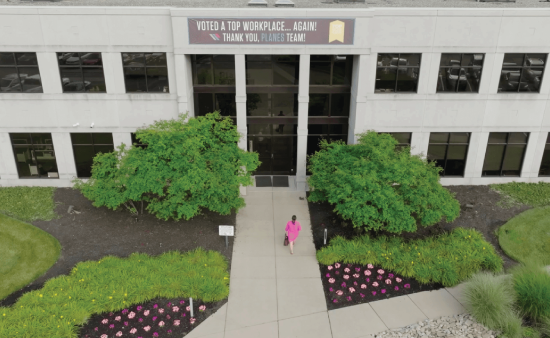 Entrance to Planes offices with Top Places to Work Banner